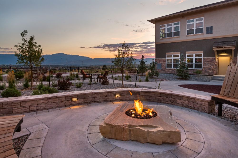 Fire Place and Court Yard at Melody Living Colorado Springs with Beautiful Views of the Mountains